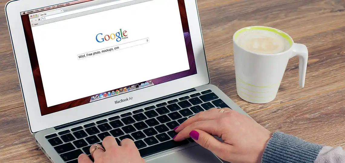 Woman Using a Laptop to Search Google