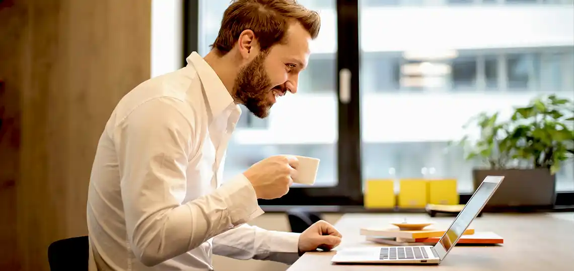 Man happy working on his computer