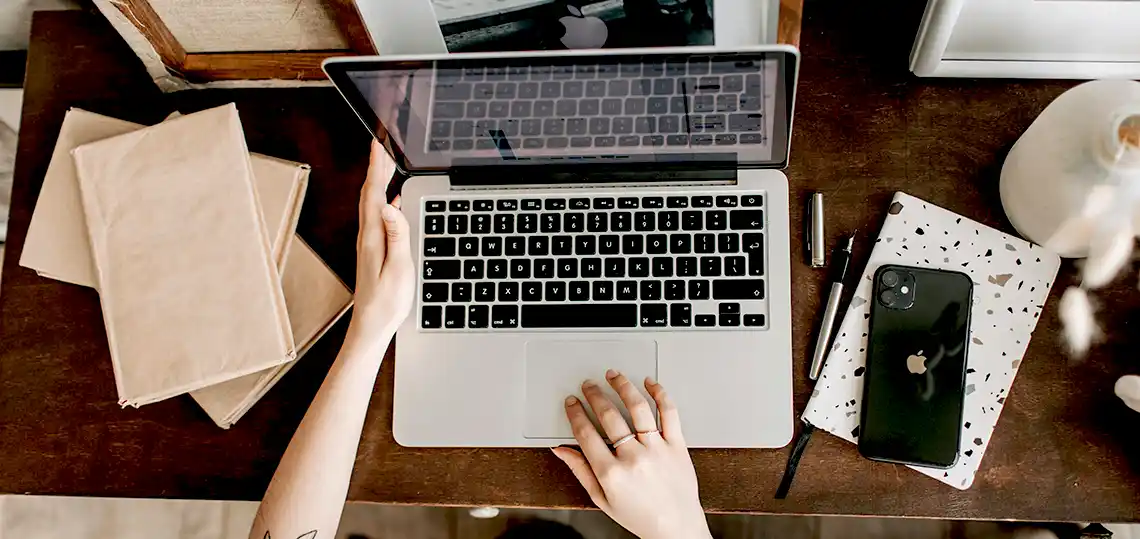 Hands on a laptop computer
