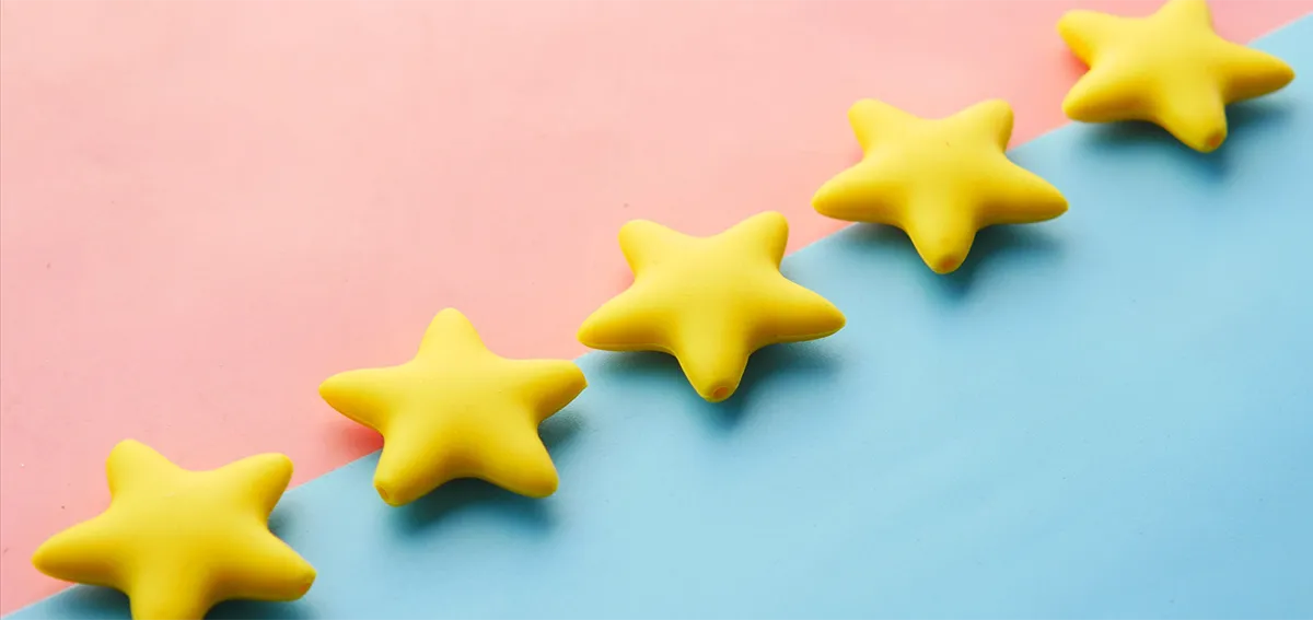 5-stars on pink and blue pastel background for rating or review concept