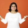 Woman with arms out looking for answers