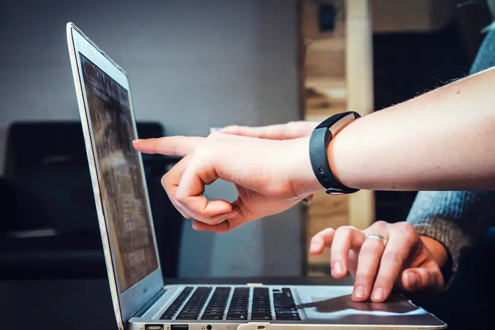 pointing the a laptop screen