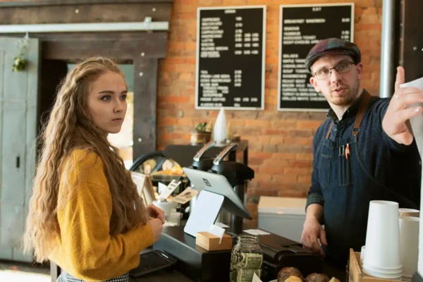 Local Coffee Shop Owner with Customer