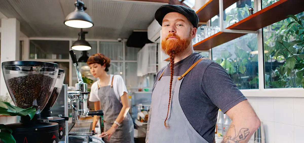 man standing in kitchen of his business