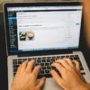 Person editing WordPress website on laptop