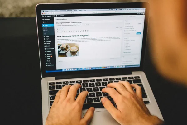 Person editing WordPress website on laptop