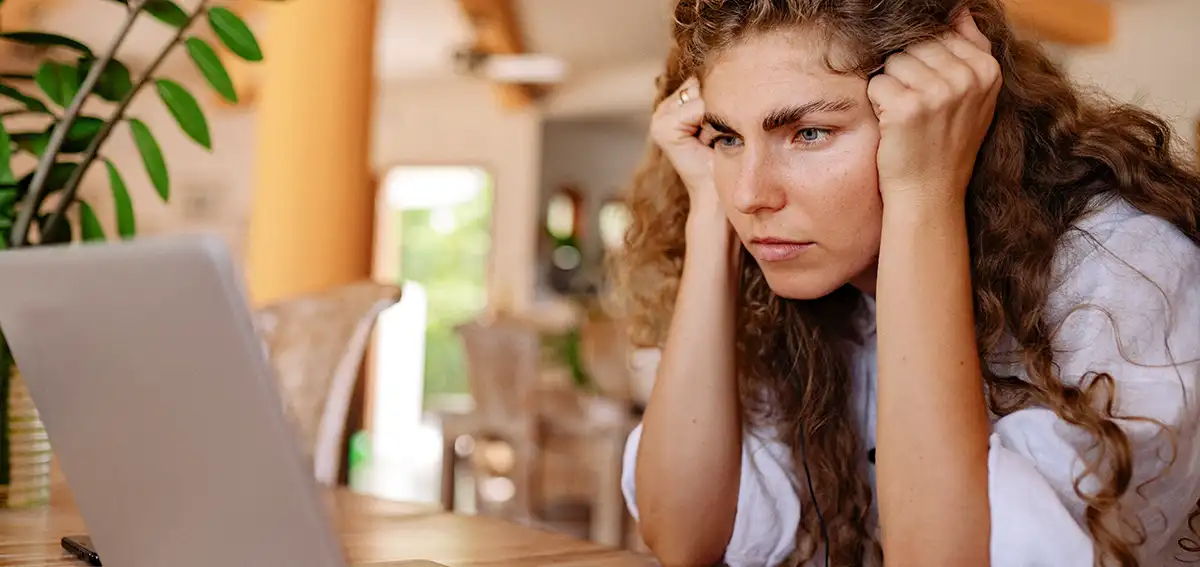 Woman concentrating on a laptop screen