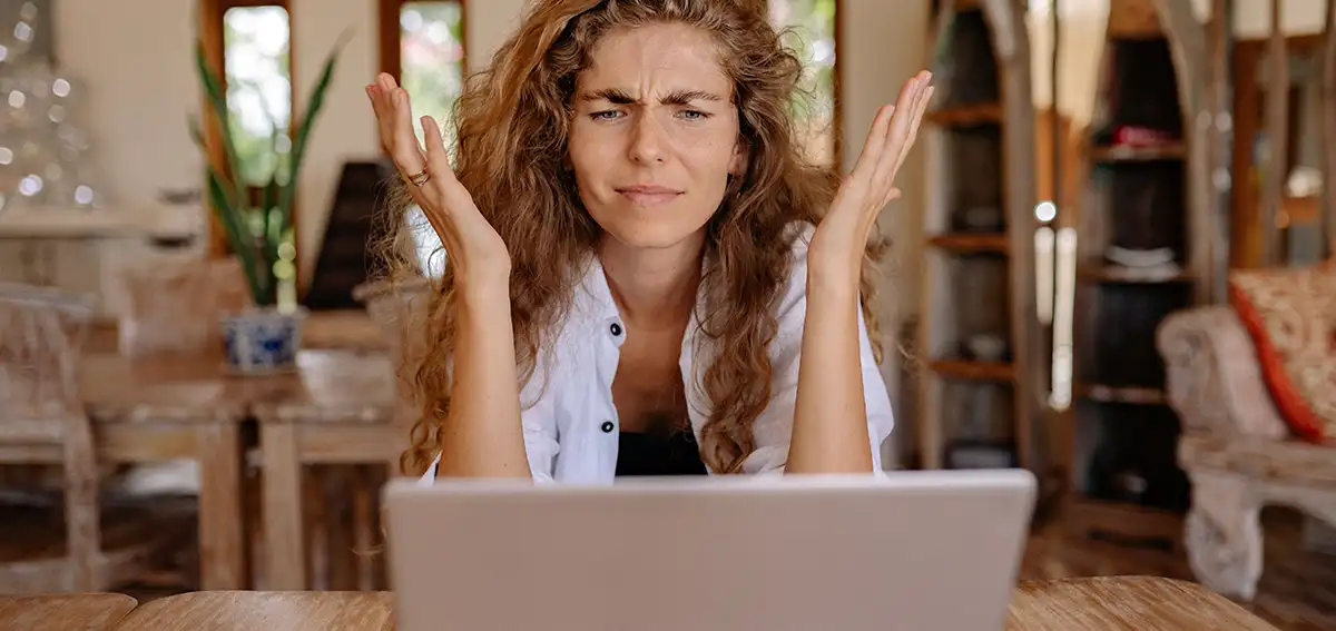 woman frustrated in front of laptop