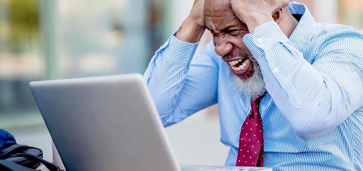 Frustrated on a laptop computer