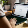 Person doing a search using Google on a laptop