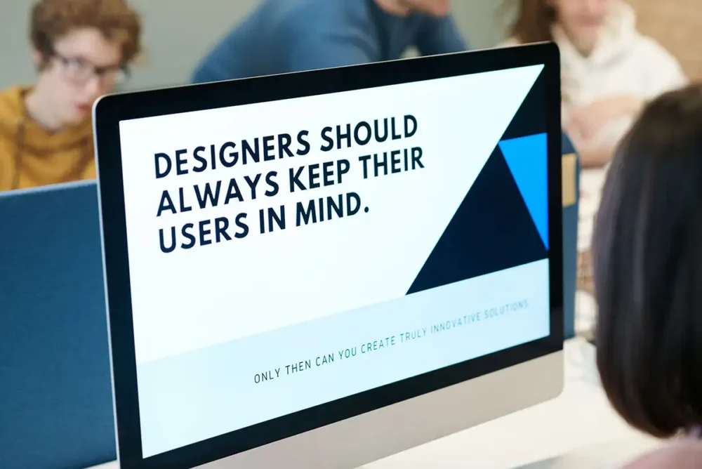 Web Designer Looking at large monitor
